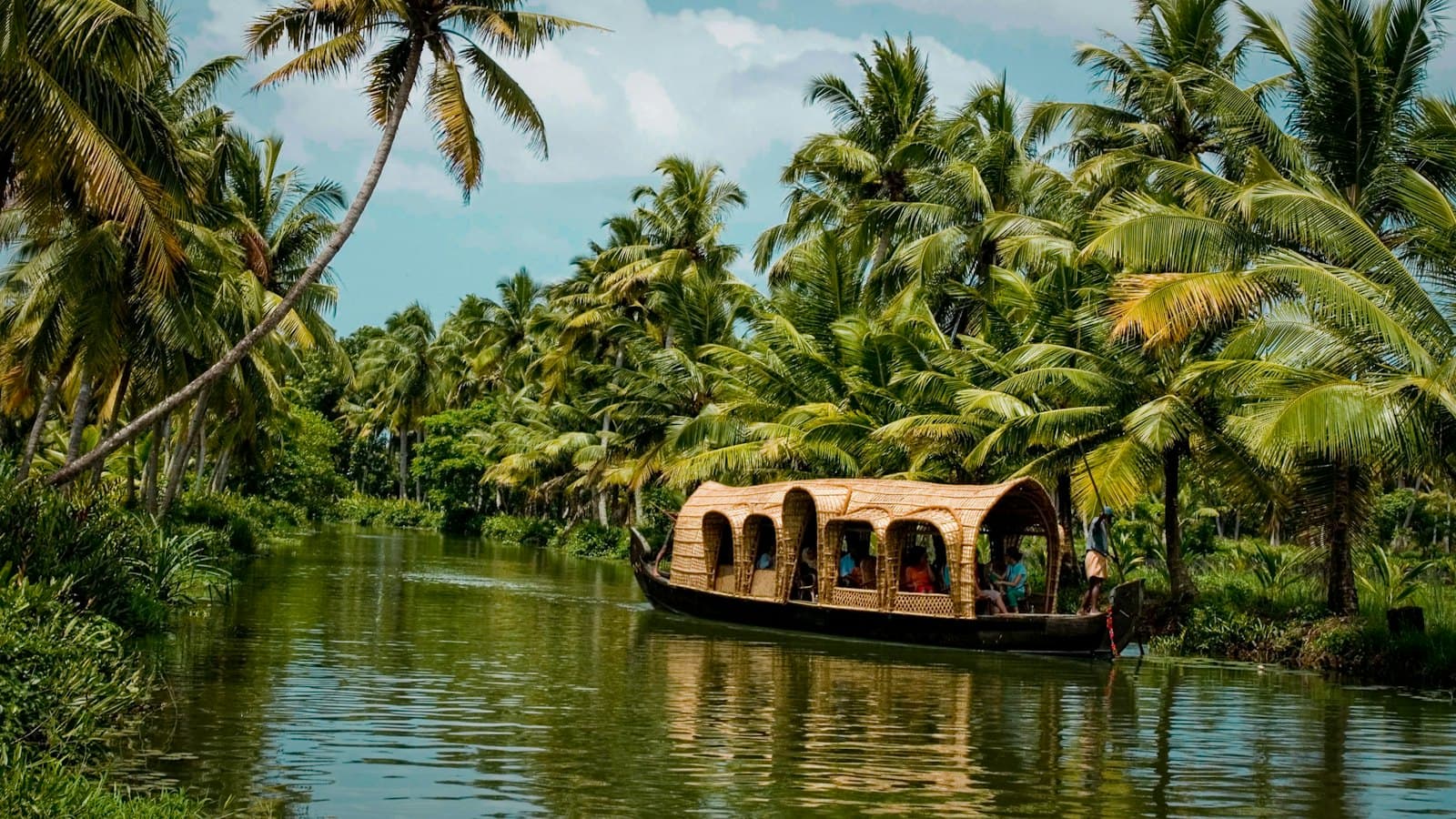 A houseboat on the palm-lined backwaters in Kerala, India